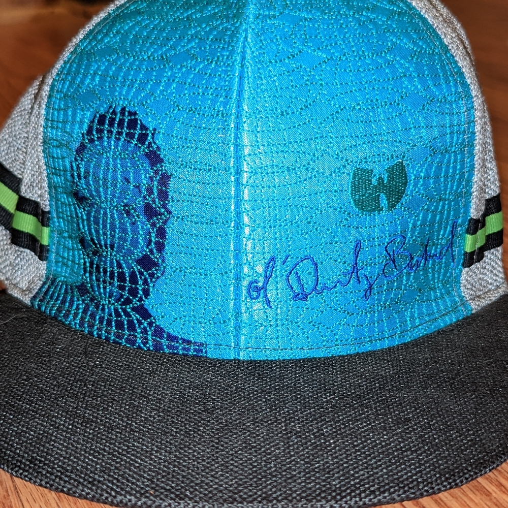 ODB Grassroots baseball cap. 7 ½ size. Primary colors are blue, Black and gray.